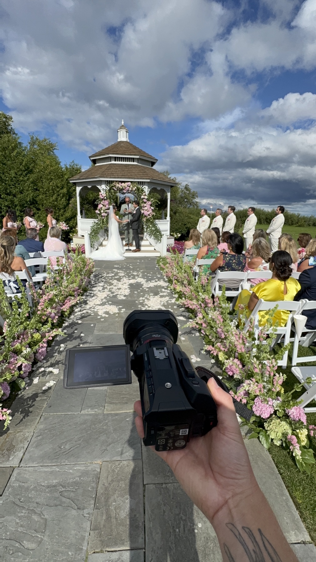 A small wedding camera positioned to record the ceremony
