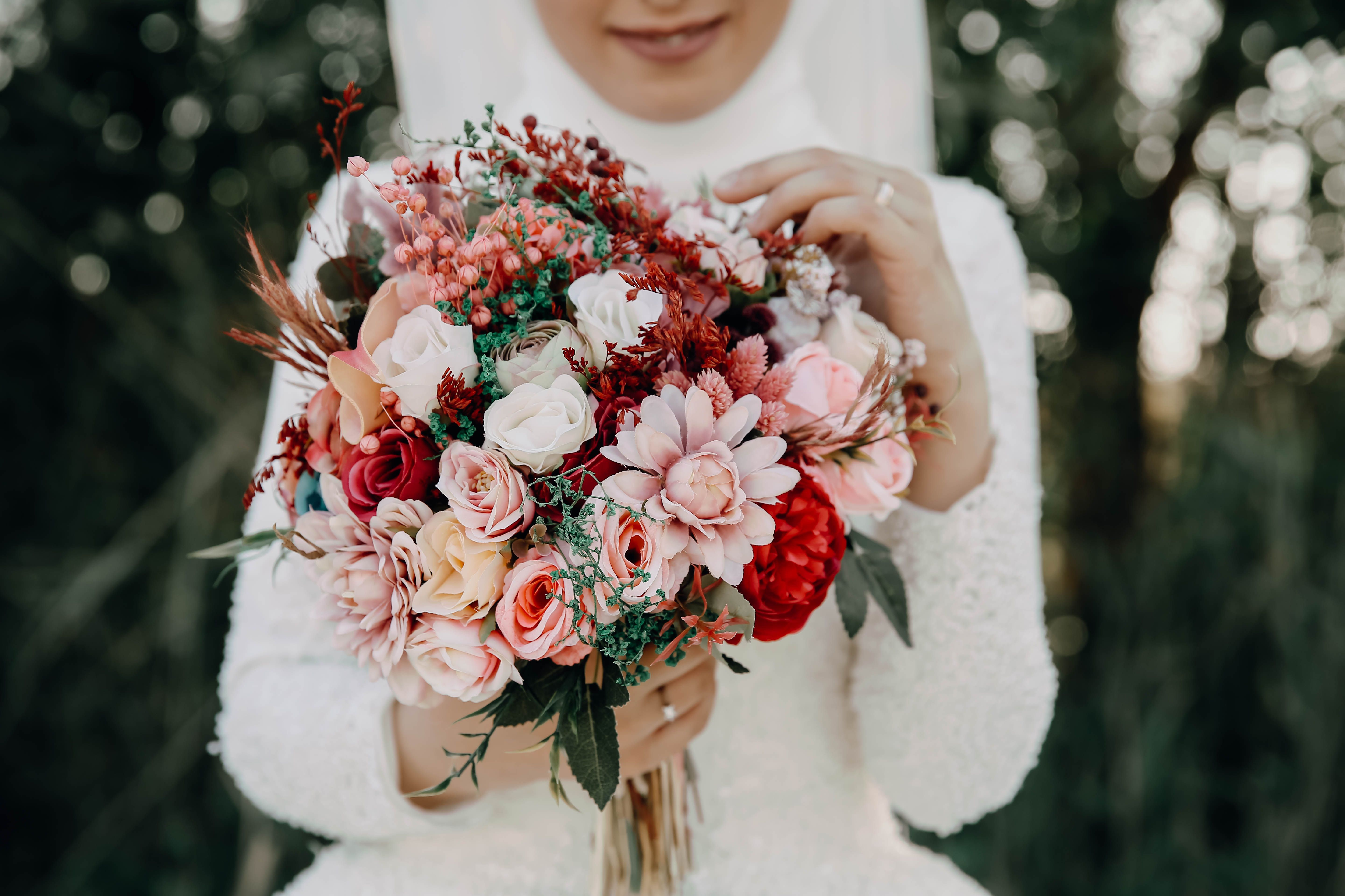Bride holding a textured white wedding bouquet