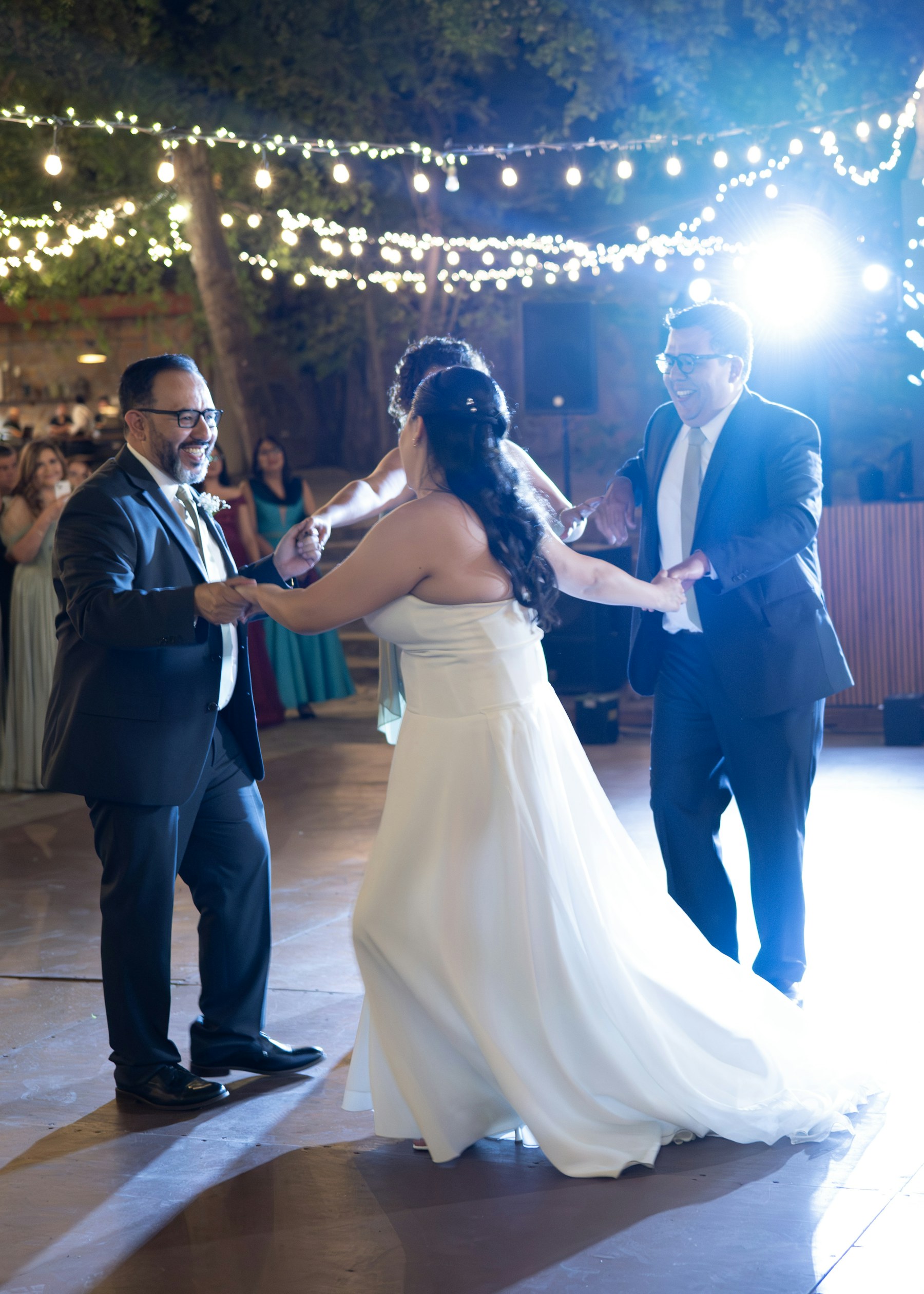 Newlywed couple sharing their first dance at a wedding reception