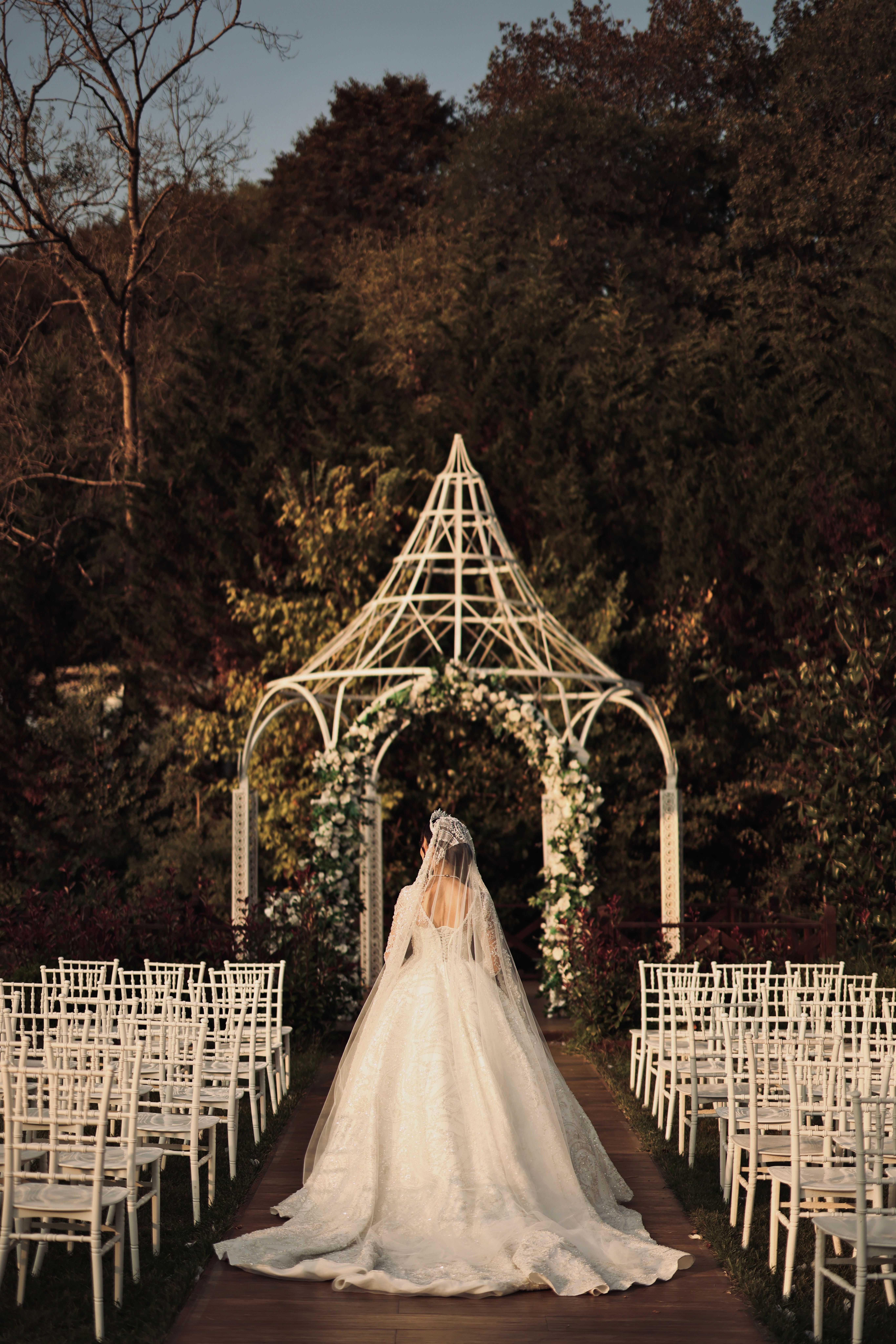Flower-lined aisle at an outdoor garden wedding