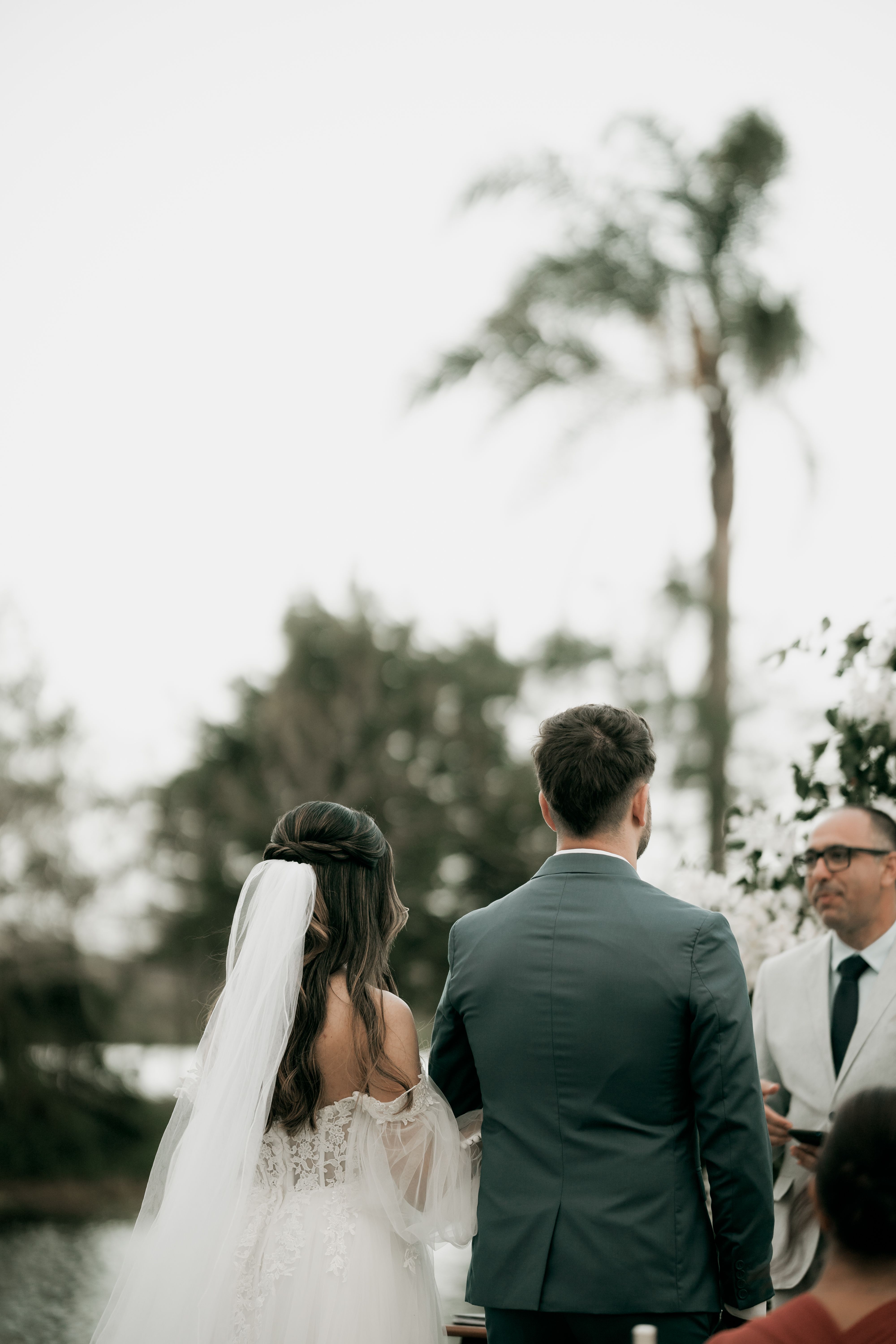 Couple exchanging vows during an outdoor wedding ceremony