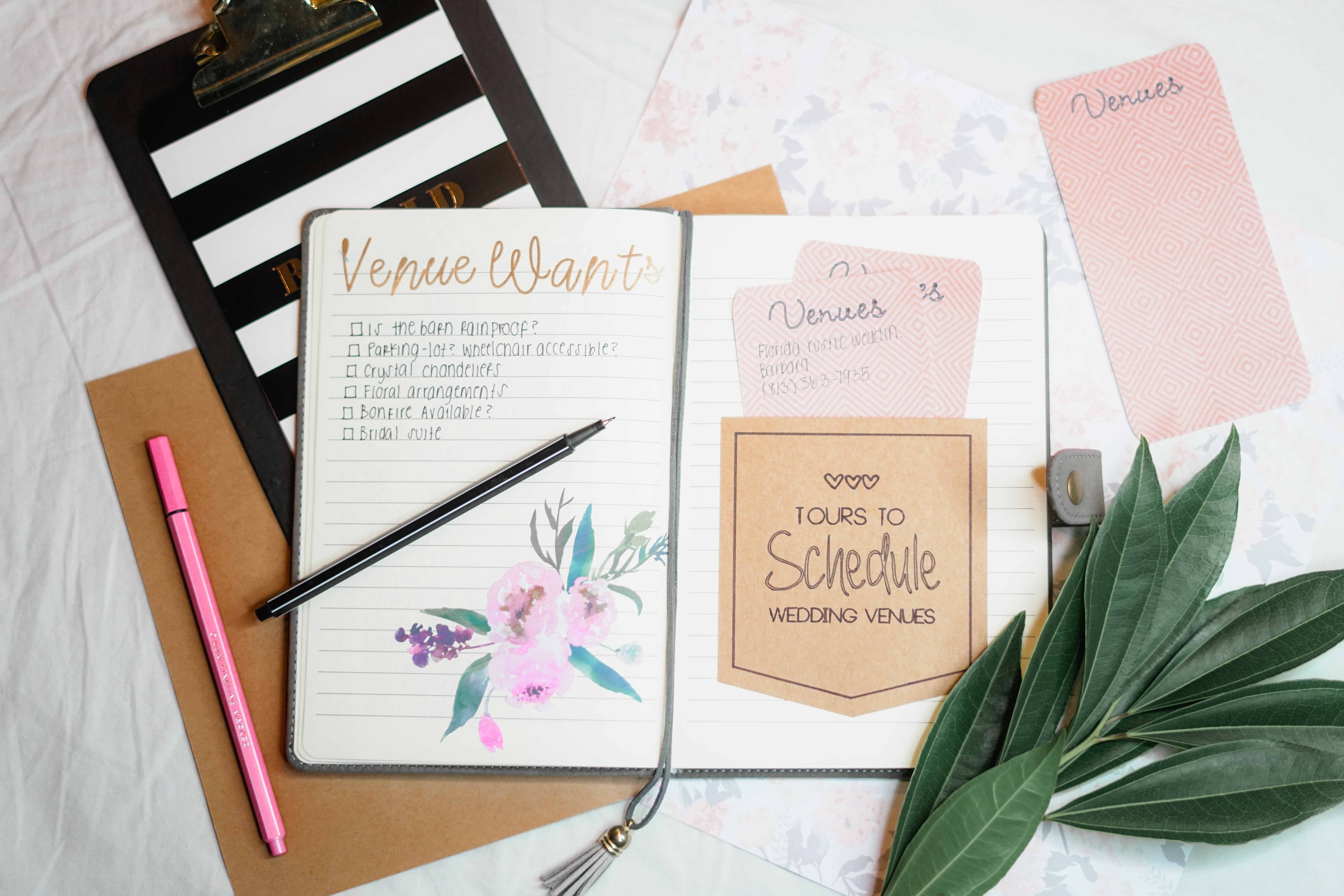 Wedding planning materials arranged on a table