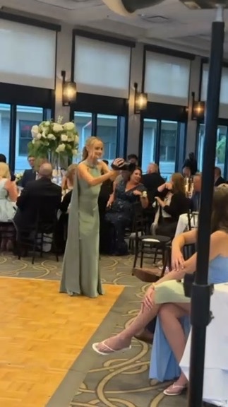 Friends capturing a wedding from inside the celebration